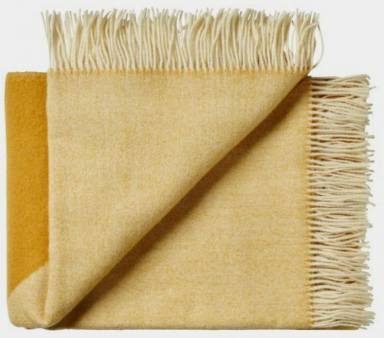 Light yellow woollen throw