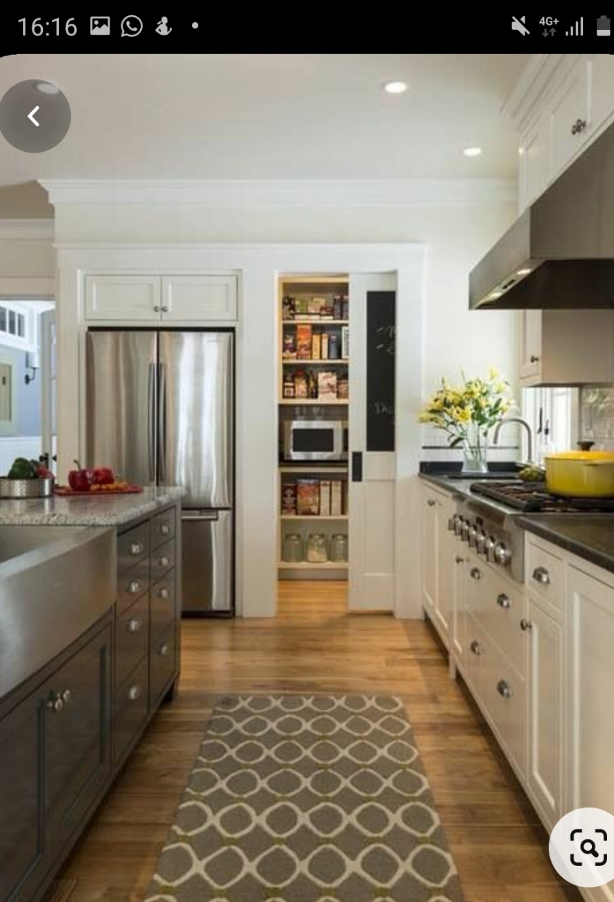 Pantry next to refrigerator 