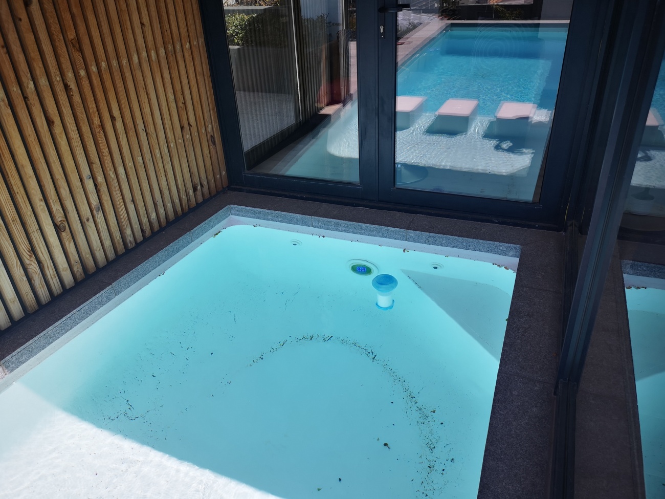 Squares in pool and wooden wall