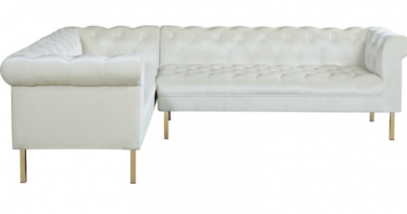 White sofa with gold legs