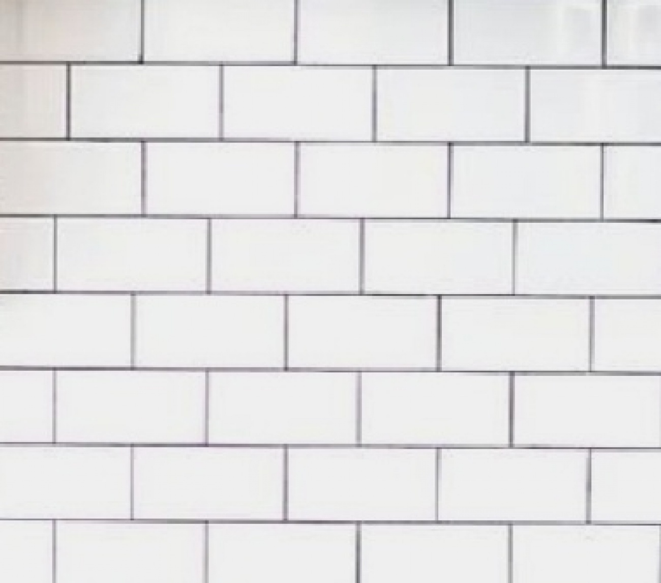 White subway tile with gray grout 